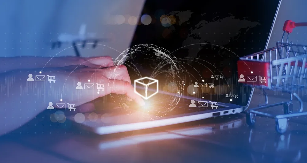 Pessoa usando notebook com ícones digitais de e‑commerce e automação de dropshipping.